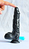 Чёрный вибромассажёр-реалистик с мошонкой на присоске с выносным пультом Sextoy 2011 00389 (22,5 см)