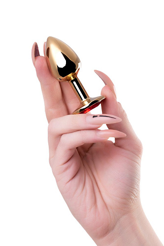 Золотистая гладкая коническая анальная пробка с красным кристаллом Штучки-дрючки 690123 (7 см)